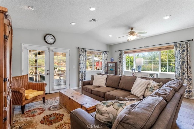 33660 White Feather Rd, Acton, CA 93510 - living room featuring a textured ceiling, vaulted ceiling, a ceiling fan, french doors, and recessed lighting