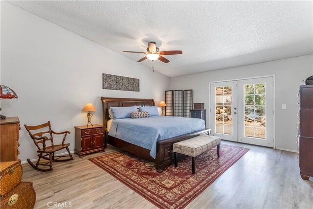 33660 White Feather Rd, Acton, CA 93510 - bedroom with access to exterior, light wood-style flooring, french doors, vaulted ceiling, and a textured ceiling