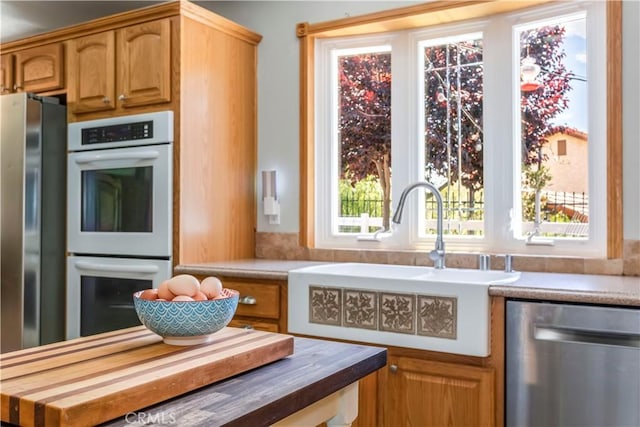 33660 White Feather Rd, Acton, CA 93510 - kitchen featuring appliances with stainless steel finishes, a sink, and wooden counters
