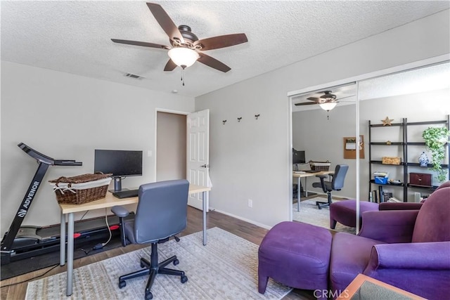 33660 White Feather Rd, Acton, CA 93510 - office space featuring a ceiling fan, wood finished floors, a textured ceiling, and baseboards