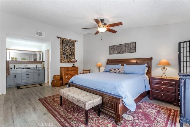 33660 White Feather Rd, Acton, CA 93510 - bedroom with wood finished floors, a textured ceiling, and ceiling fan