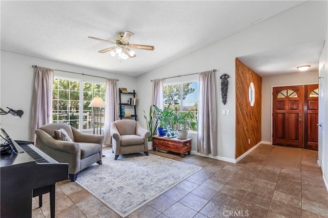 33660 White Feather Rd, Acton, CA 93510 - living area with ceiling fan, lofted ceiling, baseboards, and a textured ceiling