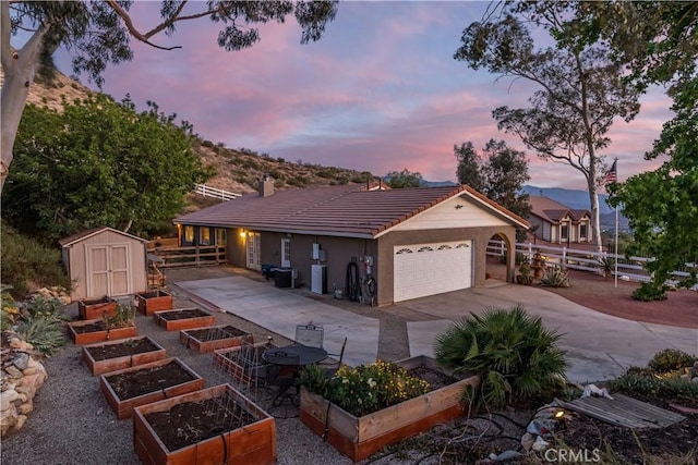33660 White Feather Rd, Acton, CA 93510 - view of front facade featuring a garden, a tiled roof, a garage, and a chimney