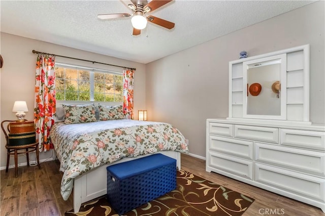 33660 White Feather Rd, Acton, CA 93510 - bedroom with a textured ceiling, wood finished floors, ceiling fan, and baseboards