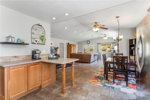 33660 White Feather Rd, Acton, CA 93510 - kitchen featuring freestanding refrigerator, a ceiling fan, lofted ceiling, a kitchen breakfast bar, and light countertops