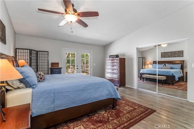 33660 White Feather Rd, Acton, CA 93510 - bedroom with access to exterior, wood finished floors, a textured ceiling, french doors, and vaulted ceiling