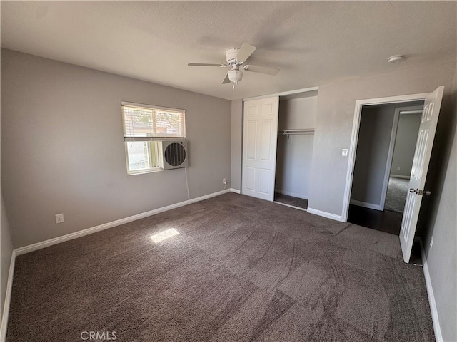 unfurnished bedroom with carpet floors, a ceiling fan, baseboards, and a closet