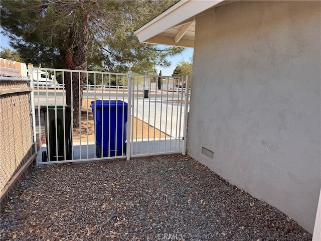 view of gate with fence