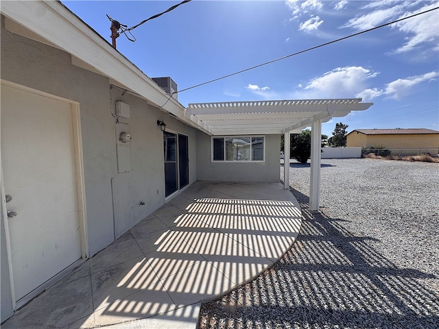 view of patio / terrace featuring fence and a pergola