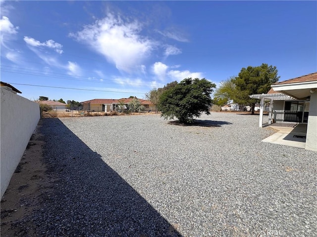 view of yard with fence and a patio area