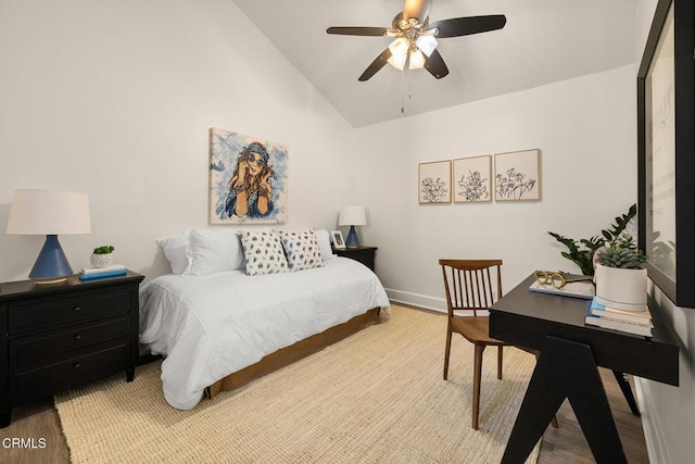 bedroom with baseboards, a ceiling fan, wood finished floors, and vaulted ceiling
