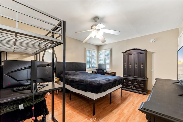 bedroom featuring a ceiling fan and light wood-style flooring