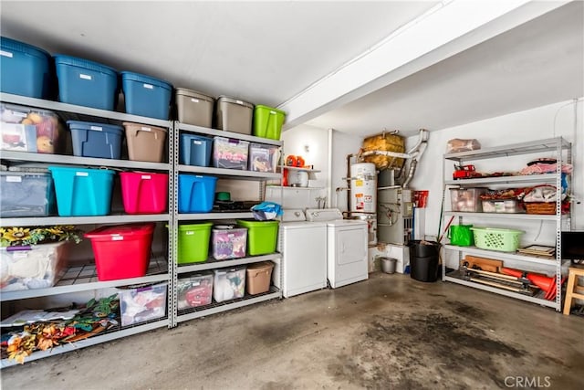 storage featuring water heater and separate washer and dryer