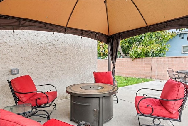 view of patio / terrace featuring fence and a gazebo