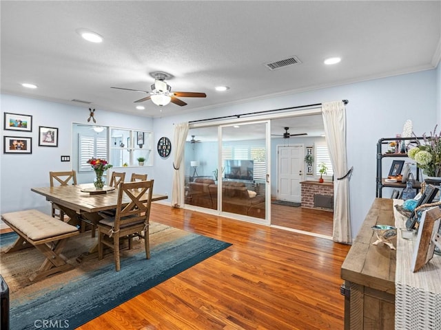 dining space featuring plenty of natural light, a ceiling fan, and visible vents