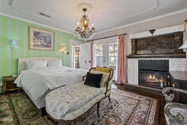 1900 Taft Ave, Los Angeles, CA 90068 - bedroom with french doors, visible vents, a notable chandelier, ornamental molding, and wallpapered walls