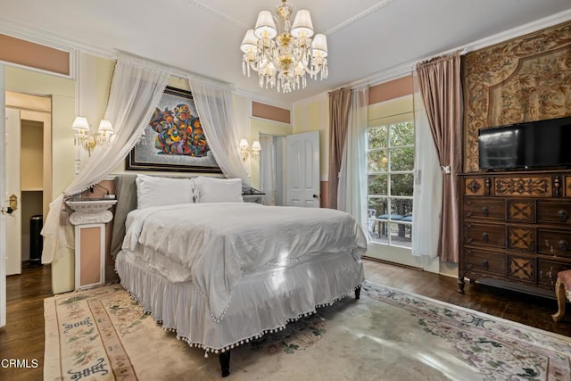 1900 Taft Ave, Los Angeles, CA 90068 - bedroom featuring an inviting chandelier, crown molding, wood finished floors, and access to exterior