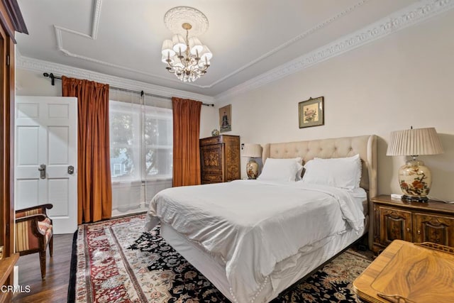 1900 Taft Ave, Los Angeles, CA 90068 - bedroom with crown molding, dark wood-type flooring, and a chandelier