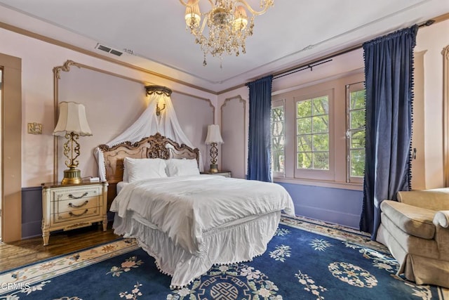 1900 Taft Ave, Los Angeles, CA 90068 - bedroom with an inviting chandelier and visible vents