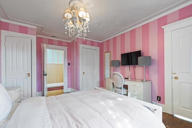 1900 Taft Ave, Los Angeles, CA 90068 - bedroom featuring crown molding, wood finished floors, baseboards, wallpapered walls, and a notable chandelier
