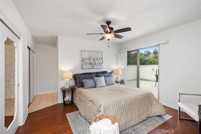 bedroom featuring a ceiling fan, baseboards, access to exterior, and wood finished floors