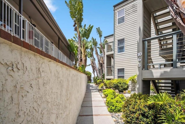 view of property exterior featuring stairs