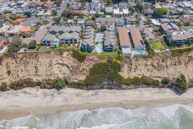 birds eye view of property featuring a residential view, a beach view, and a water view