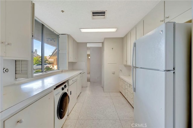 4300 Parkview Dr, Lakewood, CA 90712 - laundry area featuring laundry area, washer / dryer, light tile patterned flooring, and visible vents