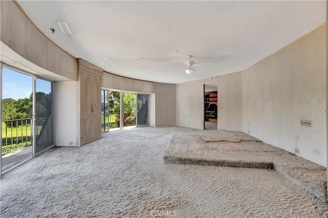 4300 Parkview Dr, Lakewood, CA 90712 - unfurnished living room featuring carpet floors, a ceiling fan, and a textured ceiling