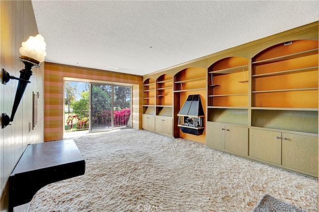 4300 Parkview Dr, Lakewood, CA 90712 - unfurnished living room featuring carpet floors, a textured ceiling, and wallpapered walls