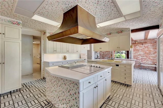 4300 Parkview Dr, Lakewood, CA 90712 - kitchen featuring a kitchen island, range hood, light countertops, a peninsula, and electric cooktop