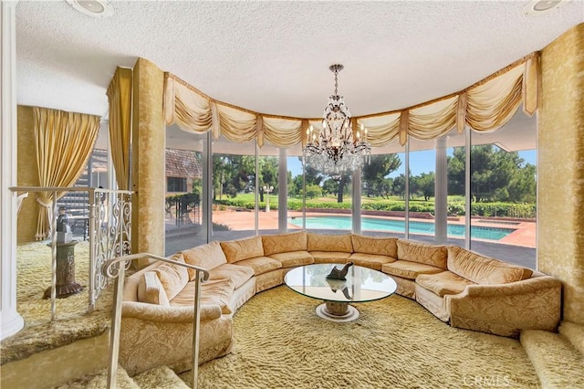 4300 Parkview Dr, Lakewood, CA 90712 - living area with a textured ceiling and a chandelier