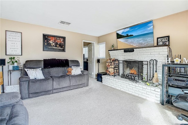 3871 San Mateo Ave, Riverside, CA 92504 - living room featuring carpet flooring, visible vents, and a brick fireplace