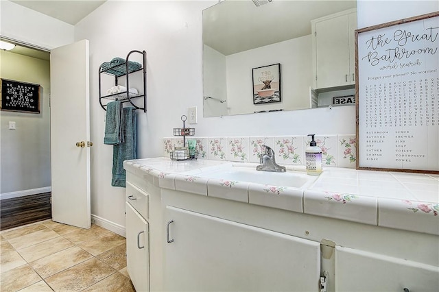 3871 San Mateo Ave, Riverside, CA 92504 - bathroom featuring baseboards, vanity, tile patterned floors, and visible vents
