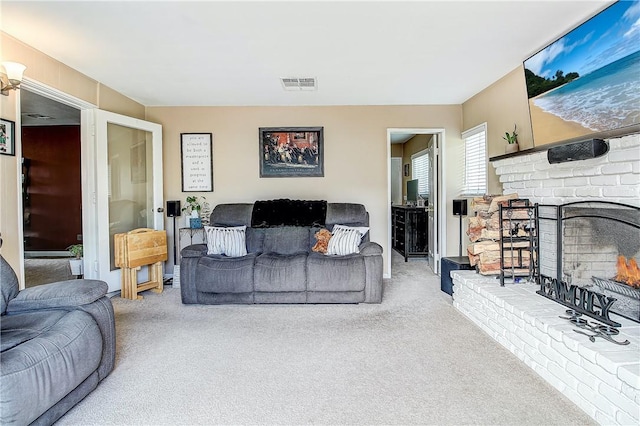 3871 San Mateo Ave, Riverside, CA 92504 - carpeted living area with a fireplace and visible vents