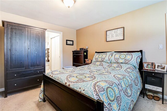 3871 San Mateo Ave, Riverside, CA 92504 - bedroom with connected bathroom and light carpet