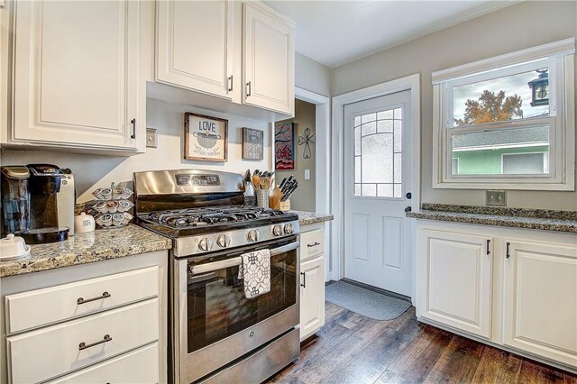 3871 San Mateo Ave, Riverside, CA 92504 - kitchen featuring stainless steel range with gas stovetop, light stone counters, dark wood finished floors, and white cabinetry