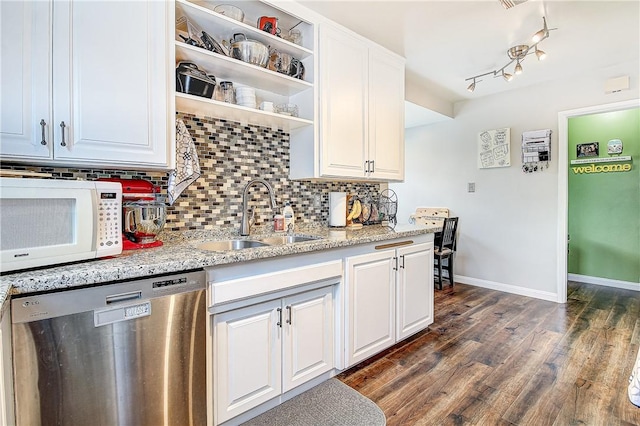 3871 San Mateo Ave, Riverside, CA 92504 - kitchen with backsplash, white microwave, a sink, and dishwasher