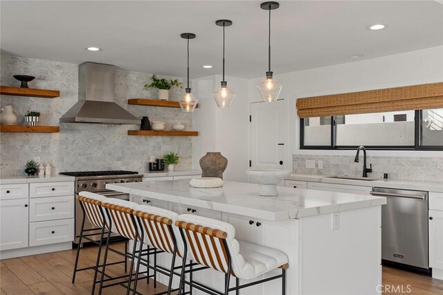317 Via Lido Nord, Newport Beach, CA 92663 - kitchen with stainless steel appliances, wall chimney exhaust hood, open shelves, a sink, and backsplash