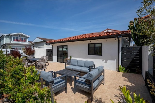 317 Via Lido Nord, Newport Beach, CA 92663 - rear view of house featuring stucco siding, a tile roof, outdoor lounge area, and a patio