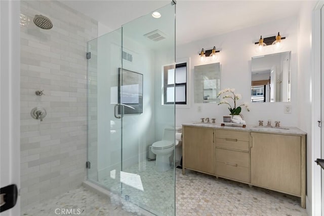 bathroom with visible vents, a stall shower, and a wealth of natural light