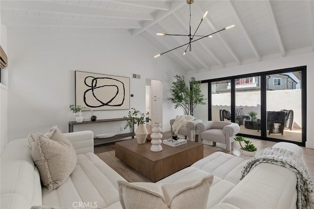 living room with visible vents, an inviting chandelier, wood finished floors, beamed ceiling, and high vaulted ceiling