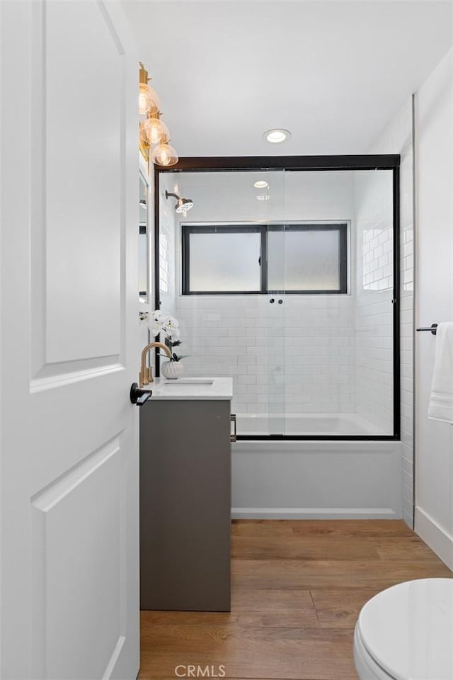 317 Via Lido Nord, Newport Beach, CA 92663 - full bathroom with vanity, shower / bath combination with glass door, toilet, wood finished floors, and recessed lighting