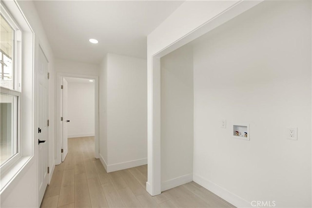 hall with light wood-style floors, baseboards, and recessed lighting