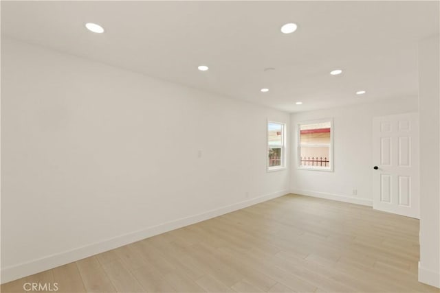 empty room featuring recessed lighting and light wood-style floors
