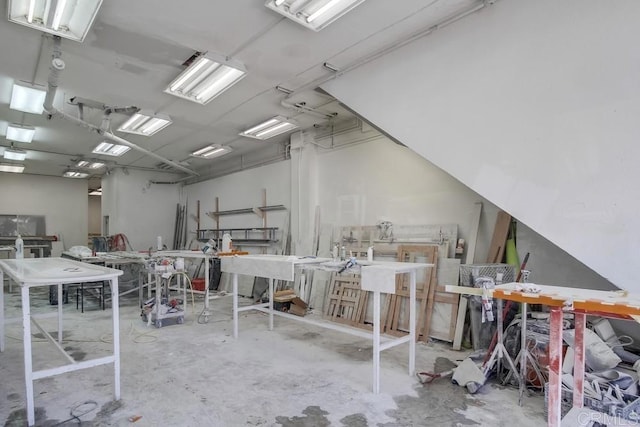 miscellaneous room with unfinished concrete flooring