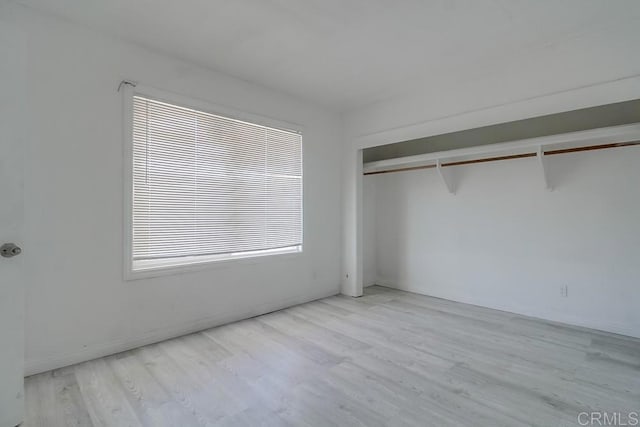unfurnished bedroom featuring wood finished floors