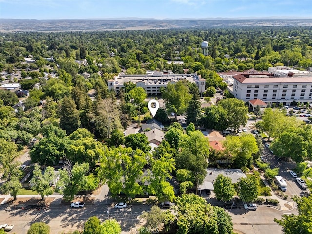 bird's eye view featuring a wooded view