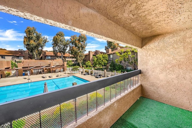 community pool with a residential view