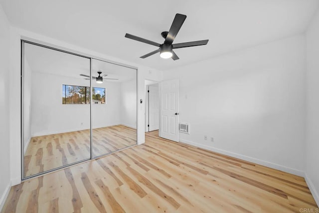 unfurnished bedroom with baseboards, ceiling fan, and wood finished floors